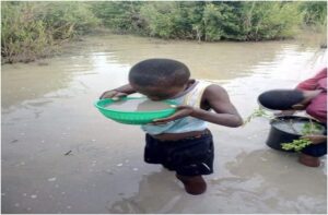 A child drinking dirty water